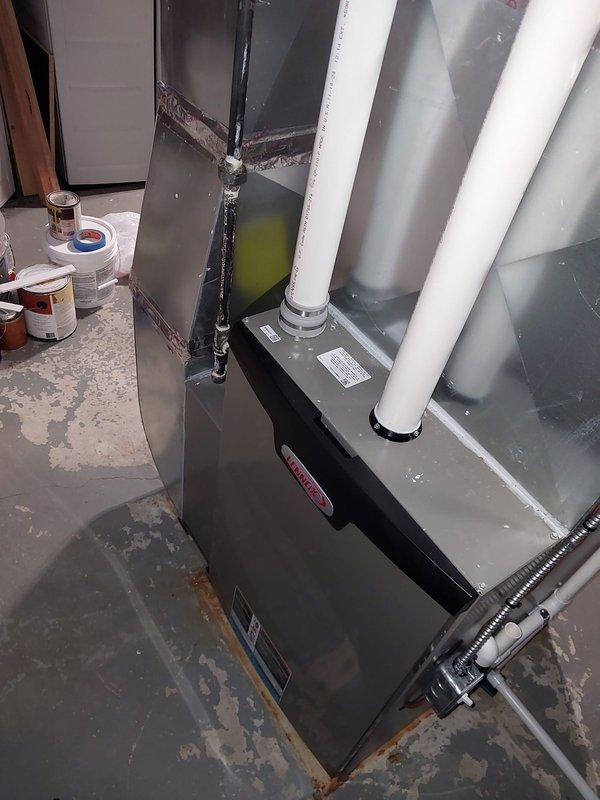 Performed comprehensive maintenance on three furnace systems and one tankless water heater as part of the Worry Free Service Agreement. Inspected and serviced the basement-installed HVAC system, including examination of the furnace unit with PVC ventilation connections and proper ductwork. Verified proper operation of the air handler unit with associated metal ductwork and condensate drainage system.