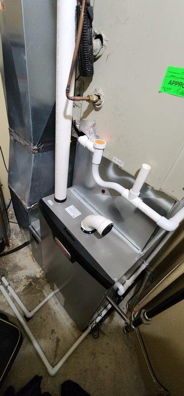 Performed annual maintenance on 1-year-old furnace under Worry Free Service Agreement. Inspected interior components including gas valve assembly, control board, electrical connections, and PVC venting system. All systems functioning properly with no issues identified; unit is operating at optimal efficiency with clean components and proper drainage confirmed.