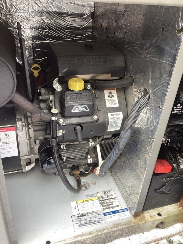 Completed annual maintenance service on Kohler residential generator. Performed spark plug inspection/replacement and checked oil levels. Unit appears to be in good working condition with normal operational wear.