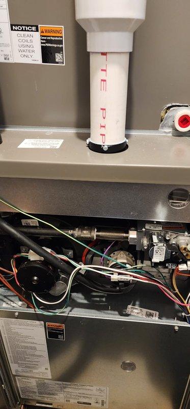 Performed routine maintenance on Goodman furnace per Worry Free Service Agreement. Inspected internal components including blower motor, control board, and wiring connections. Examined PVC venting system and checked black insulated ductwork for proper installation and function.