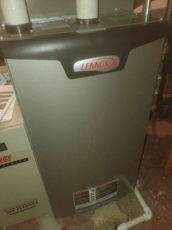 Performed fall maintenance on Lennox furnace under Worry Free Service Agreement. Removed front panel to inspect internal components including motor assembly, circuit board, and wiring connections. All components showed normal wear and appear to be functioning properly. Visual inspection of exhaust/intake pipes confirmed proper installation with no visible issues.