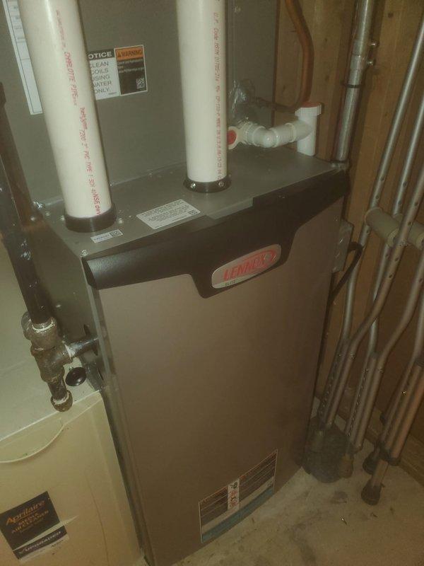 Performed comprehensive furnace maintenance on Lennox heating system. Inspected all internal components including blower motor assembly, control boards, and wiring connections. Verified proper operation of PVC intake/exhaust venting system and confirmed drainage piping was functioning correctly with no signs of leakage or blockage.