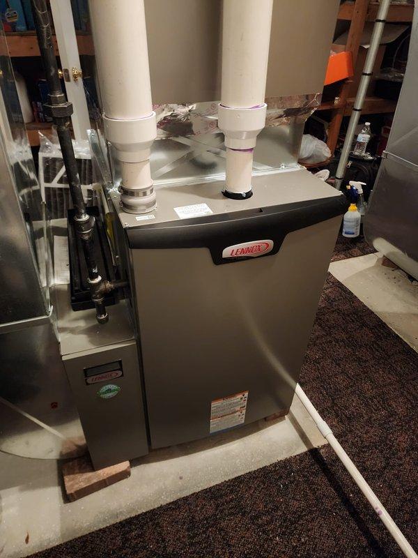Performed scheduled maintenance on two Lennox furnace systems located in basement utility area. Both units were inspected, cleaned, and tested for proper operation. PVC exhaust/intake pipes were examined for secure connections and proper venting.