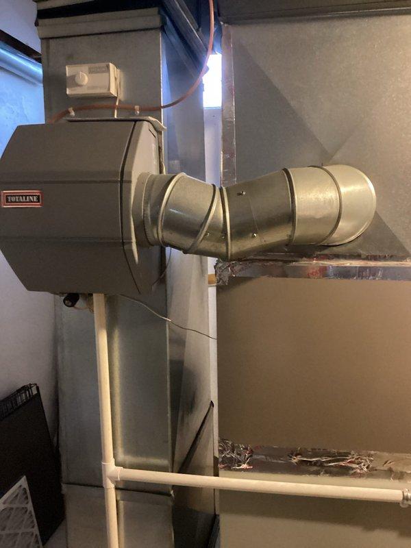 Conducted HVAC system evaluation for replacement quote (CQ Quote: 03743-01). Inspected existing TotalLine air handler/furnace unit with connected galvanized sheet metal ductwork and associated control systems. Documented current installation configuration including ventilation setup with PVC piping, copper line connections, and ductwork layout for comprehensive replacement estimate.