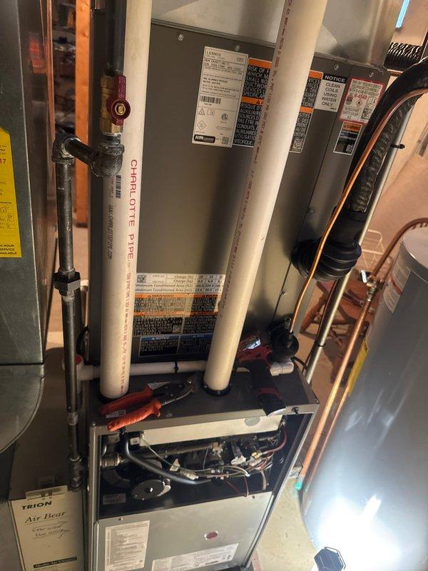 Successfully completed installation of a complete Lennox HVAC system, including furnace, air conditioner, and T6 thermostat. System was properly connected with PVC ventilation piping and copper refrigerant lines, with all components secured and tested for optimal performance.