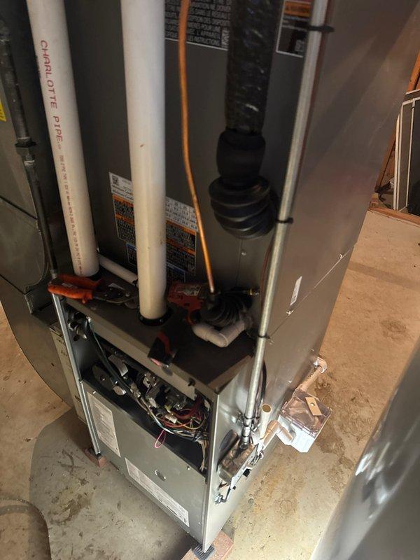 Successfully completed installation of a complete Lennox HVAC system, including furnace, air conditioner, and T6 thermostat. System was properly connected with PVC ventilation piping and copper refrigerant lines, with all components secured and tested for optimal performance.