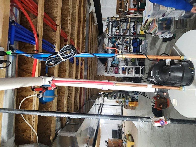 Successfully installed a 50-gallon Bradford White water heater in the customer's unfinished basement utility area. Completed all necessary plumbing connections using PEX piping system (red for hot water, blue for cold water) secured to joists, and ensured proper venting. Left the old tank on-site as requested for insurance inspection purposes.