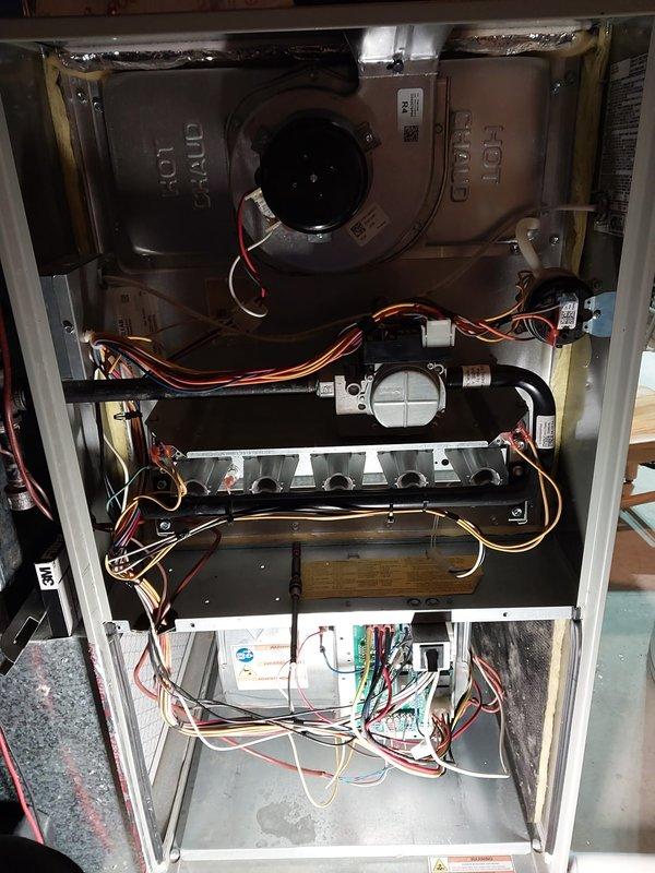 Performed scheduled maintenance on furnace under Worry Free Service Agreement. Accessed internal components for inspection, including blower motor assembly, control board, and gas valve assembly. All electrical connections and wiring were verified secure with no visible issues observed.