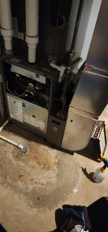 Performed comprehensive heating maintenance service on residential HVAC system under Worry Free Service Agreement. Inspected furnace unit, verified proper operation of intake and exhaust PVC venting, and checked all plumbing connections including copper pipes and valves. System appears to be an ALLSTYLE brand unit installed in basement utility area.