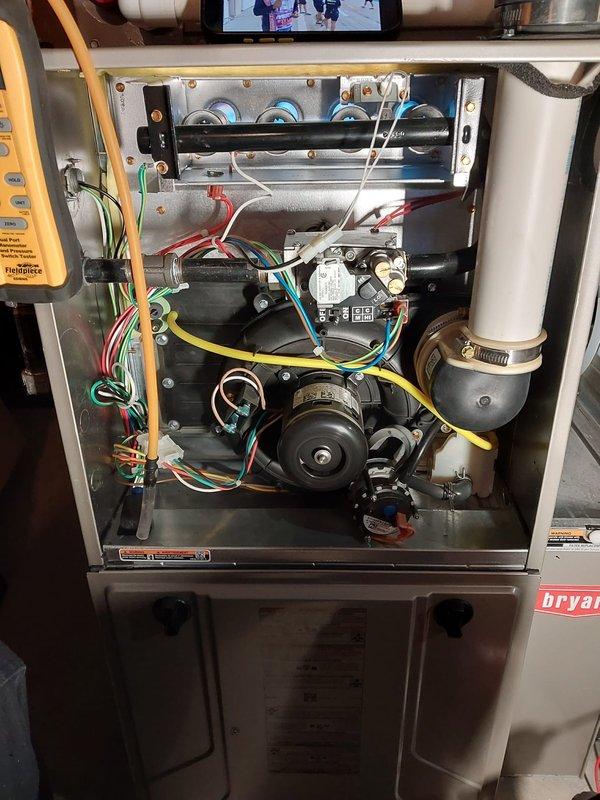Performed comprehensive furnace maintenance inspection on Bryant unit due to customer complaint of reduced heat output. Accessed interior components, inspected blower motor assembly, checked electrical connections, and evaluated exhaust system. Completed all standard maintenance procedures under Worry Free Service Agreement to restore optimal heating performance.