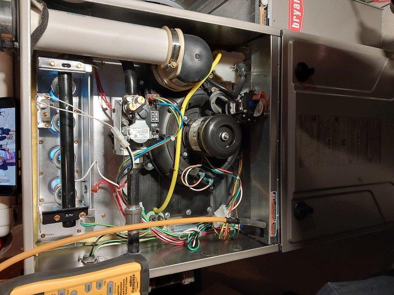 Performed comprehensive furnace maintenance inspection on Bryant unit due to customer complaint of reduced heat output. Accessed interior components, inspected blower motor assembly, checked electrical connections, and evaluated exhaust system. Completed all standard maintenance procedures under Worry Free Service Agreement to restore optimal heating performance.