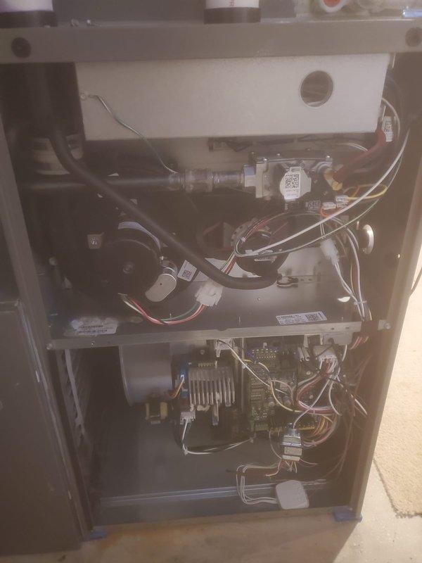 Performed annual heating maintenance on a 1-year-old furnace located in basement under Worry Free Service Agreement. Conducted comprehensive inspection of internal components including combustion chamber, heat exchanger, electrical connections, control boards, and gas valve assembly. System functioning properly with no issues identified; all components in good working condition.