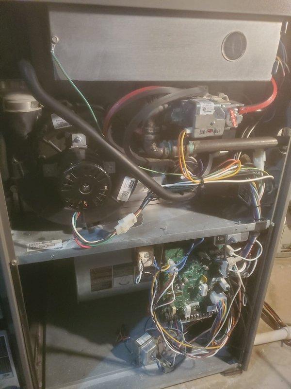 Completed routine furnace maintenance on Lennox heating system. Inspected all internal components including blower motor, electrical connections, circuit board, gas valve assembly, and ventilation system. All systems functioning normally with no signs of wear or damage.