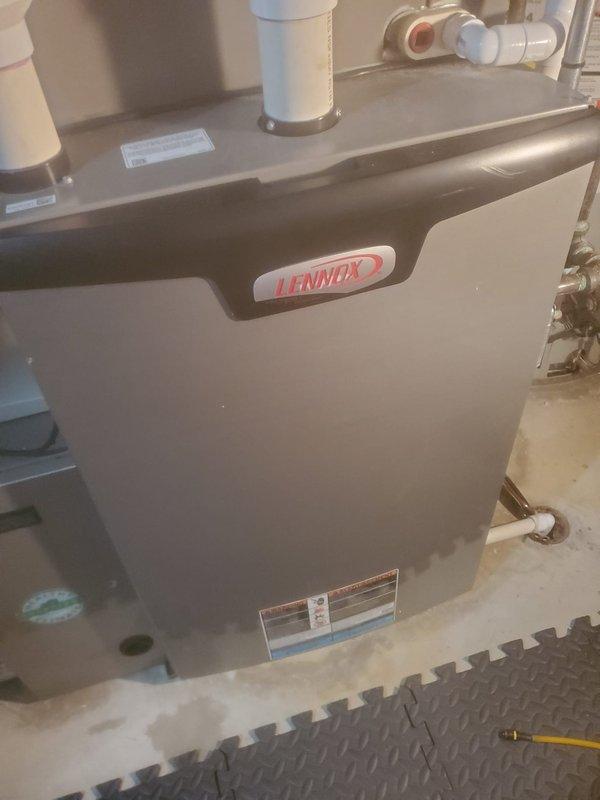 Completed routine furnace maintenance on Lennox heating system. Inspected all internal components including blower motor, electrical connections, circuit board, gas valve assembly, and ventilation system. All systems functioning normally with no signs of wear or damage.