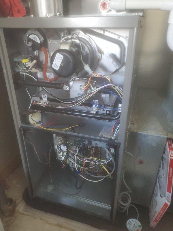 Performed scheduled preventive maintenance on Lennox furnace including inspection of internal components (control board, wiring connections, motor assemblies) and verification of proper exhaust/intake ventilation. All systems functioning normally with no visible damage or issues identified. Documented condition with photos showing both internal components and external installation.