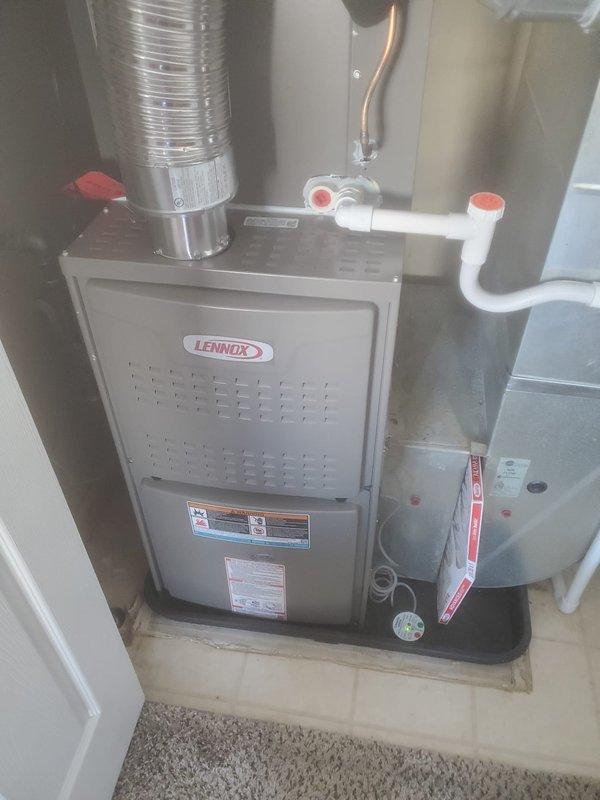 Performed scheduled preventive maintenance on Lennox furnace including inspection of internal components (control board, wiring connections, motor assemblies) and verification of proper exhaust/intake ventilation. All systems functioning normally with no visible damage or issues identified. Documented condition with photos showing both internal components and external installation.