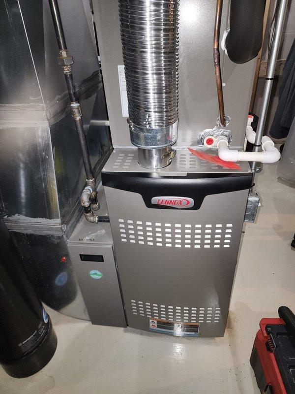 Performed comprehensive maintenance on Lennox and Bryant heating systems under Worry Free Service Agreement. Inspected both furnace units for proper operation including ductwork, ventilation, plumbing connections, PVC drainage systems, and associated valves. Units appeared in good working condition with no visible damage or deterioration; all components functioning as designed.