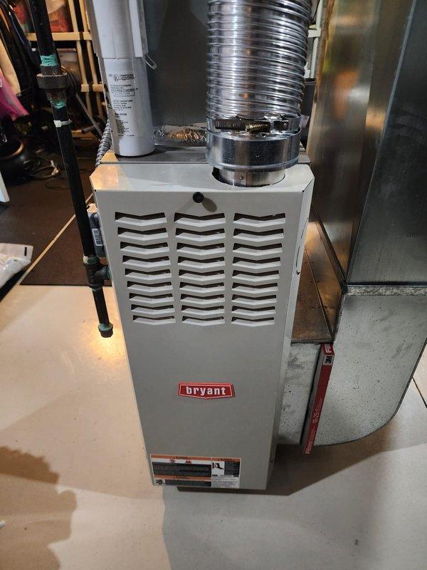 Performed comprehensive maintenance on Lennox and Bryant heating systems under Worry Free Service Agreement. Inspected both furnace units for proper operation including ductwork, ventilation, plumbing connections, PVC drainage systems, and associated valves. Units appeared in good working condition with no visible damage or deterioration; all components functioning as designed.