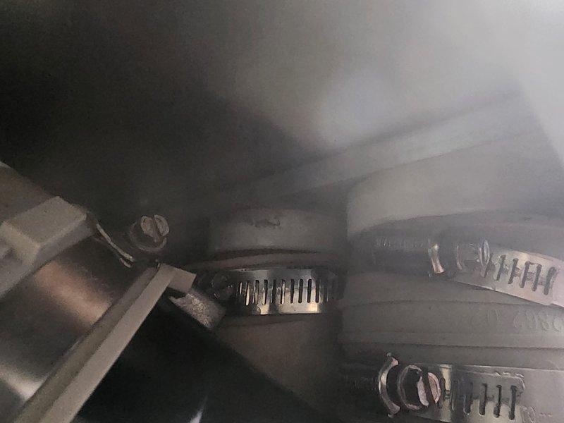 Responded to callback for exhaust odor complaint following recent installation. Inspected exhaust connection points and identified loose hose clamps on venting system. Tightened all clamps to manufacturer specifications and verified proper sealing of exhaust components to eliminate gas leakage causing the reported odor.