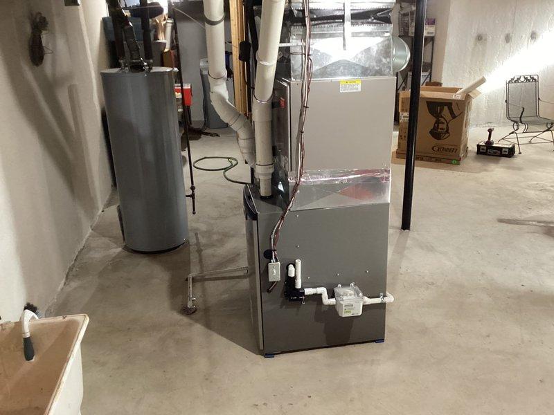 Successfully installed a new Lennox furnace unit with associated ductwork in the basement utility room, connecting all necessary PVC venting and condensate lines. Completed installation of S40 thermostat and verified proper system operation with all connections secure and system functioning to manufacturer specifications.