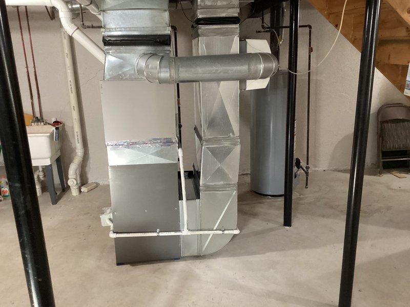 Successfully installed a new Lennox furnace unit with associated ductwork in the basement utility room, connecting all necessary PVC venting and condensate lines. Completed installation of S40 thermostat and verified proper system operation with all connections secure and system functioning to manufacturer specifications.