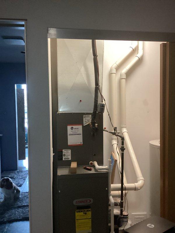 Conducted HVAC replacement estimate for residential system featuring a Lennox furnace unit with PVC exhaust/intake ventilation and connected ductwork. Assessment included evaluation of existing air handler with insulated line set and reflective foil insulation. Photos documented current installation configuration to support comprehensive replacement proposal.