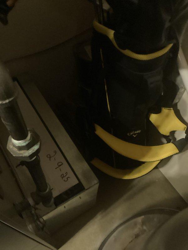 Conducted comprehensive assessment of residential HVAC system for potential replacement. Inspected existing furnace/air handler unit with connected PVC drainage system and condensate trap, noting energy efficiency ratings. Evaluated adjacent water heater installation and examined secondary equipment components including secured cylindrical element with retention straps and associated pipe fittings.