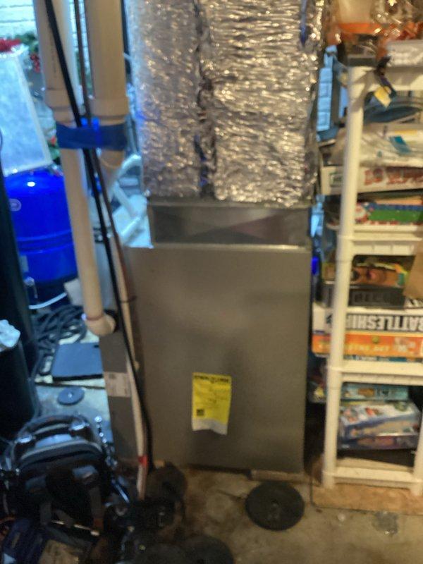 Performed comprehensive assessment of aging HVAC system showing significant wear, including rust development on metal components and evidence of water damage on surrounding floor. Inspection revealed deteriorated electrical components within the mechanical unit, compromised PVC piping connections, and suboptimal ductwork insulation. Recommended complete system replacement to address reliability concerns and improve energy efficiency.