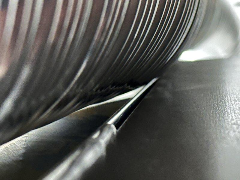 Responded to callback for whistling noise from newly installed 90,000 BTU furnace. Inspection revealed improper sealing at connection points, confirmed by evidence of corrosion on existing pipe fitting adjacent to newer coil components. Resealed all furnace connections and verified proper operation of complete system (4-ton AC, S40 thermostat, and humidifier) with no further noise issues.