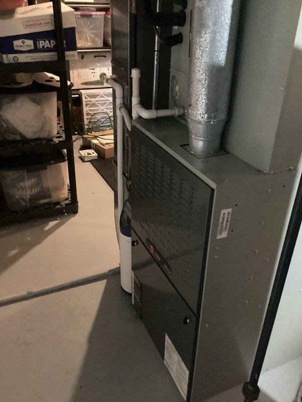 Performed inspection of existing HVAC system in basement utility area. Documented current installation including furnace unit with connected ductwork, drainage components, and ventilation piping. Prepared replacement estimate for complete system upgrade (Quote #03767-01 and #03767-02) with installation timeline of 6-7 days.