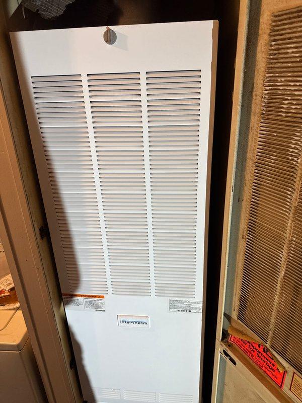 Successfully installed a complete HVAC system including a Revolv furnace, Lennox air conditioner, and T6 thermostat in the customer's utility area. The Intertherm unit was properly mounted within the wooden framed enclosure with all manufacturer labels intact and visible, and the system was tested to ensure optimal functionality.