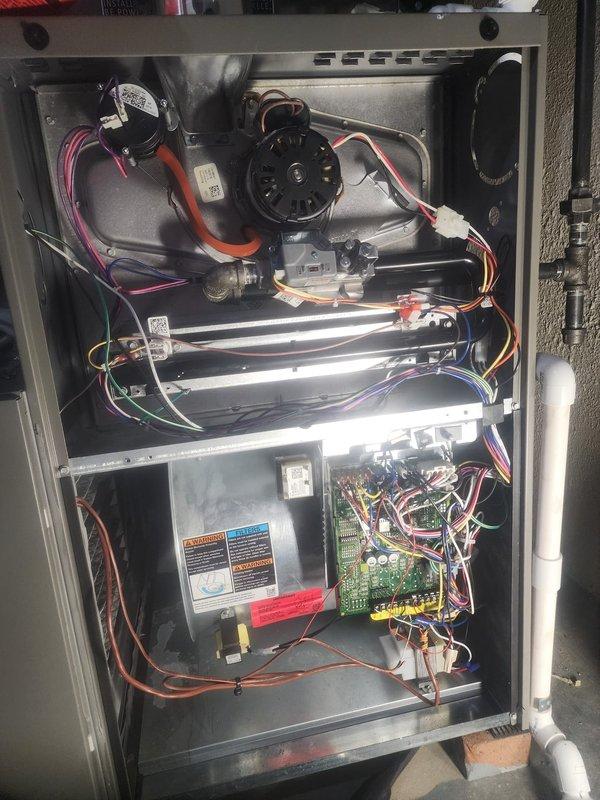 Performed scheduled maintenance on Lennox furnace between 8A-10A. Inspected interior components including blower motor assembly, electronic control board, and wiring connections - all in normal working condition with no visible damage. Documented condition of unit with photos showing proper installation of PVC venting and verified all safety systems functioning correctly.