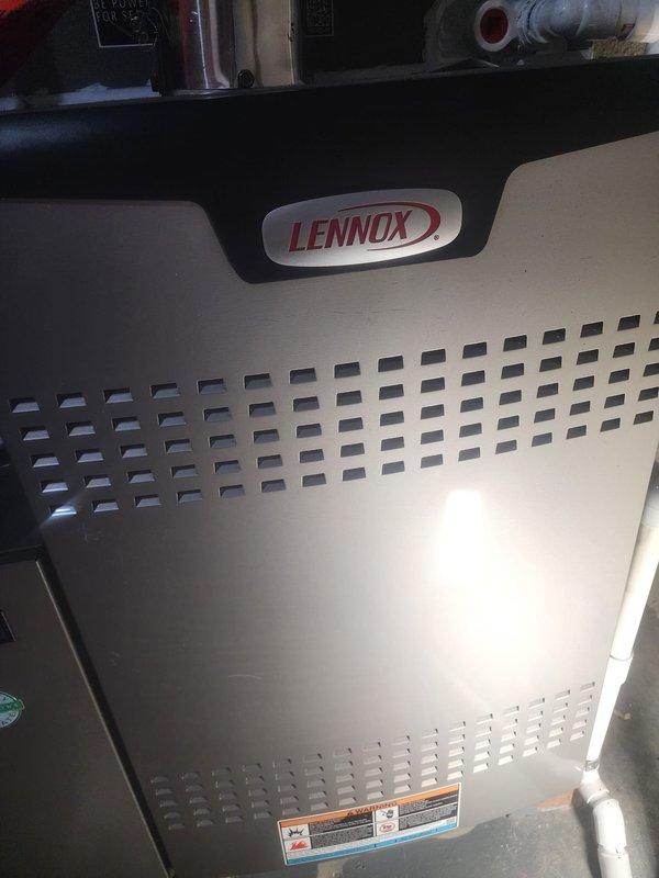 Performed scheduled maintenance on Lennox furnace between 8A-10A. Inspected interior components including blower motor assembly, electronic control board, and wiring connections - all in normal working condition with no visible damage. Documented condition of unit with photos showing proper installation of PVC venting and verified all safety systems functioning correctly.