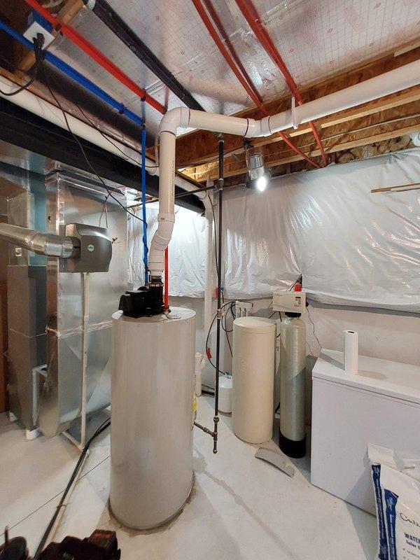 Responded to service call for leaking water heater located in basement. Upon inspection, identified leak source on 7.5-year-old tanked water heater that had been actively leaking for 2-3 days. Completed replacement of affected components, verified proper operation of water heating system and inspected adjacent plumbing infrastructure including PEX and copper supply lines.