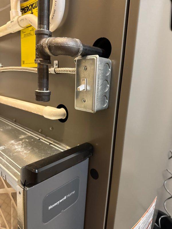 Completed installation of a complete HVAC system including a new Lennox furnace, air conditioner, and Ecobee6 smart thermostat. System installation included proper condensate drainage with PVC piping, electrical connections with junction box and toggle switch, and all necessary mechanical components mounted on appropriate drain pan with secure wall brackets.