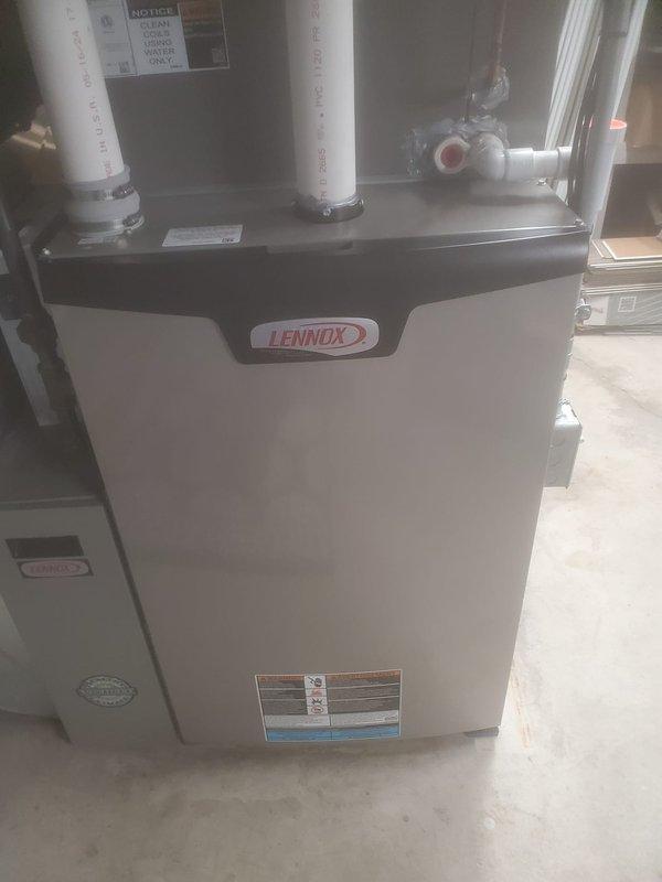 Completed prepaid maintenance service on a Lennox furnace system. Removed front panel to inspect internal components including control boards, wiring connections, and heat exchange elements. Checked PVC venting system and valve connections, ensuring proper function of all components per manufacturer specifications.