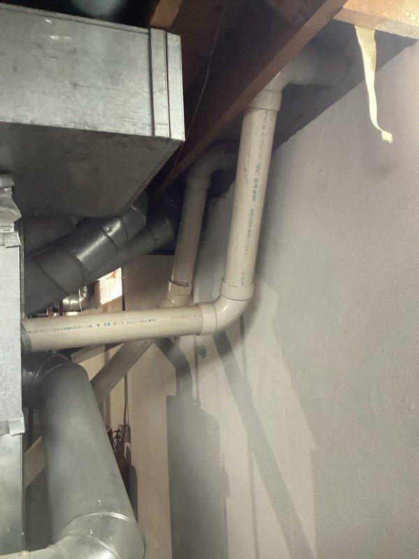 Conducted inspection of 16-year-old HVAC system revealing significant deterioration requiring replacement. Identified non-functional humidifier with faulty valve. Documented basement conditions including existing ductwork and plumbing infrastructure for proper system replacement planning.