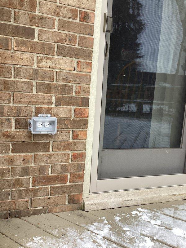 Diagnosed and repaired a non-functioning exterior weatherproof electrical outlet and its associated switch. Inspected connections in both the brick-mounted GFCI outlet box and the related interior switch, resolving the issue by replacing damaged wiring and ensuring proper grounding of the outdoor fixture.