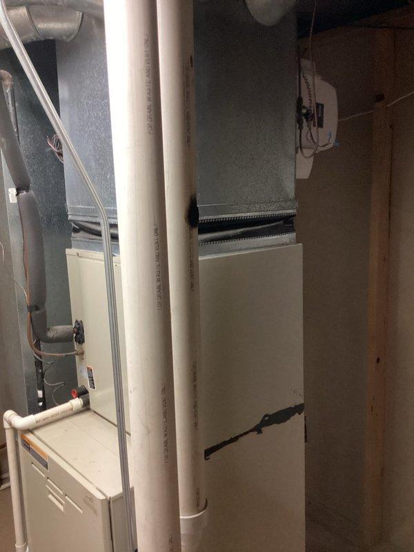 Conducted furnace replacement estimate in utility room/basement area. Inspected existing HVAC system including furnace unit, ventilation components, ductwork, and associated electrical connections. Documented current installation with photos to develop appropriate replacement options for aging equipment.