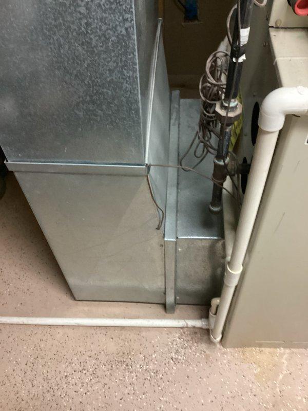 Conducted furnace replacement estimate in utility room/basement area. Inspected existing HVAC system including furnace unit, ventilation components, ductwork, and associated electrical connections. Documented current installation with photos to develop appropriate replacement options for aging equipment.