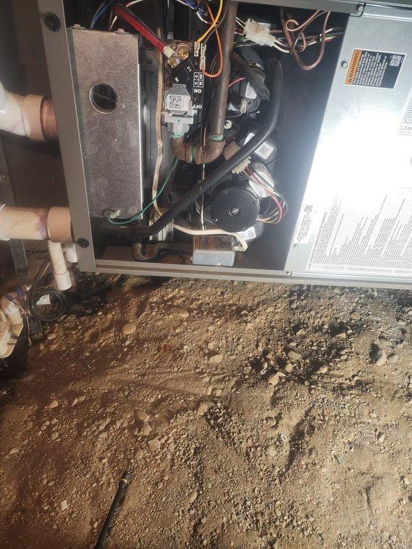 Completed scheduled 10-12 furnace maintenance service on a Rheem heating system installed in a crawlspace/basement area. Performed comprehensive inspection of all components including motor, fan assembly, electrical connections (verified integrity of red, blue, yellow, white, and green wiring), and PVC venting system. Unit was operational with normal wear; no significant issues detected.