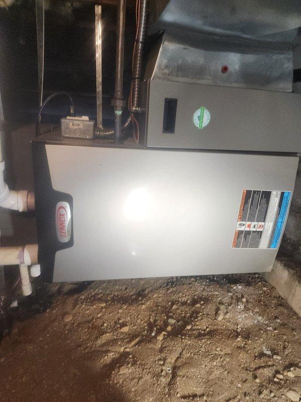 Completed scheduled 10-12 furnace maintenance service on a Rheem heating system installed in a crawlspace/basement area. Performed comprehensive inspection of all components including motor, fan assembly, electrical connections (verified integrity of red, blue, yellow, white, and green wiring), and PVC venting system. Unit was operational with normal wear; no significant issues detected.