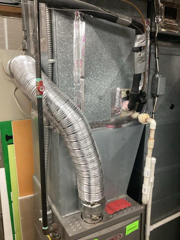 Performed a site assessment for replacement of aging AC unit with documentation of existing Lennox HVAC system. Evaluated current installation configuration including ductwork, PVC ventilation piping, and refrigerant lines to determine compatibility requirements for new equipment. Documented system location and access considerations for future replacement work.