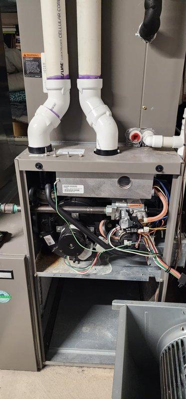 Performed scheduled maintenance on Lennox furnace system. Inspected all components including gas valve assembly, control board, and wiring harnesses, which were found to be in normal working condition. Verified proper installation of PVC ventilation/exhaust piping with all connections secure and intact.