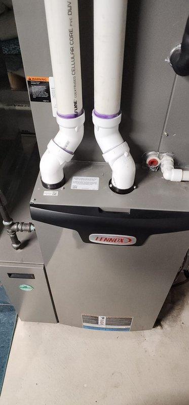 Performed scheduled maintenance on Lennox furnace system. Inspected all components including gas valve assembly, control board, and wiring harnesses, which were found to be in normal working condition. Verified proper installation of PVC ventilation/exhaust piping with all connections secure and intact.
