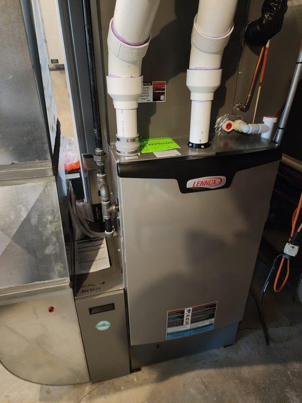 Completed heating maintenance service on dual Lennox furnace system per Worry Free Service Agreement. Inspected both units, verified proper venting through PVC exhaust pipes, and checked all electrical and plumbing connections. Both systems are in good working condition with no signs of damage or deterioration.