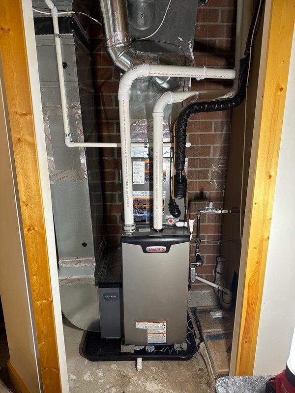 Successfully completed installation of two identical Lennox HVAC systems, each including a furnace, air conditioner, S40 thermostat, and humidifier. Systems were properly mounted with appropriate drain pans, with all ductwork, PVC venting, electrical connections, and condensate lines installed according to manufacturer specifications.