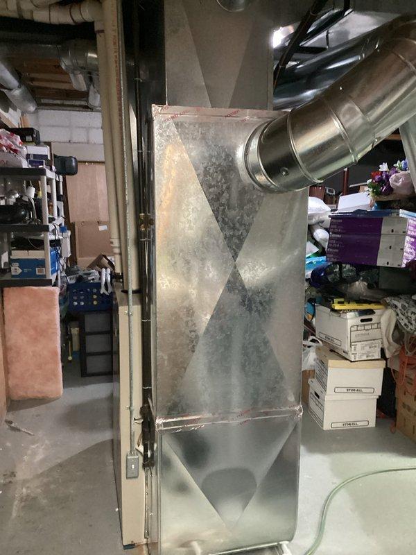 Inspected 30-year-old furnace system and confirmed failed blower motor bearings requiring replacement. Existing unit shows typical age-related wear with deteriorating galvanized cabinet and outdated efficiency standards. Recommended complete system replacement to address reliability concerns and improve energy efficiency.