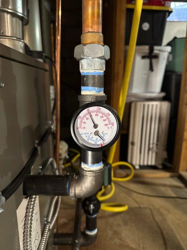 Successfully installed a new Lennox boiler system with T6 Thermostat and chimney liner according to sales specifications. Installation included proper configuration of copper pipe network with multiple shut-off valves, pressure gauge mounting, and connection to expansion tank. System was fully tested with all components functioning as designed.