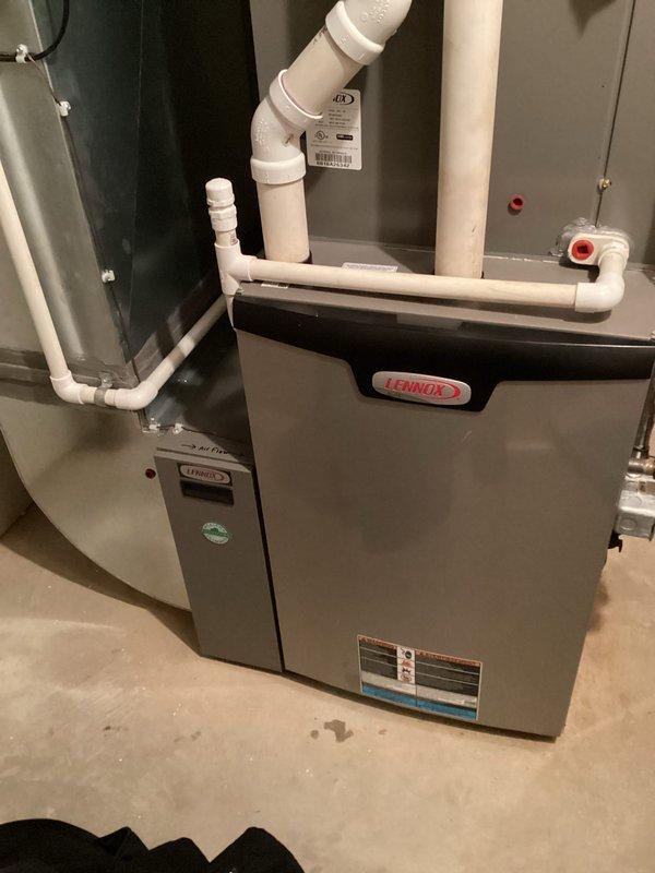 Performed routine maintenance on Lennox furnace system. Inspected all internal components including gas valve assembly, wiring harnesses, and ventilation piping for proper function and safety compliance. Verified proper installation of PVC drainage/ventilation system with all connections secure and operational.